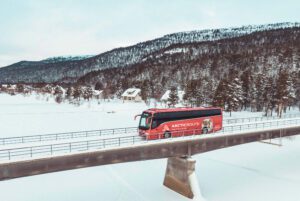 A photo of the bus in the Arctic lanscape