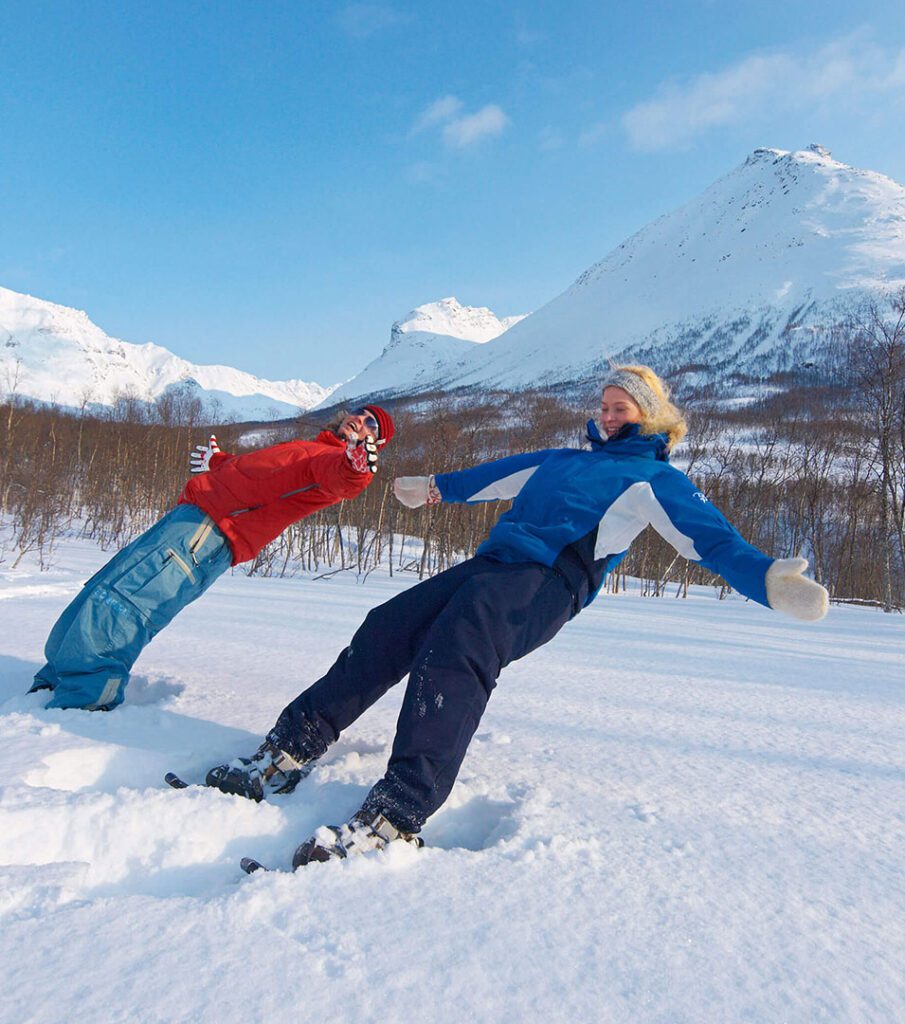 Two people having fun in the snow