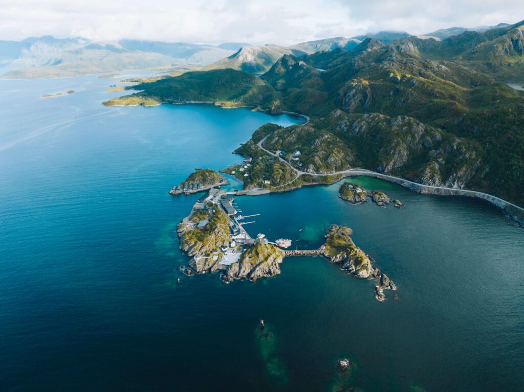 Hamn I Senja drone shot, green mountains and blue waters