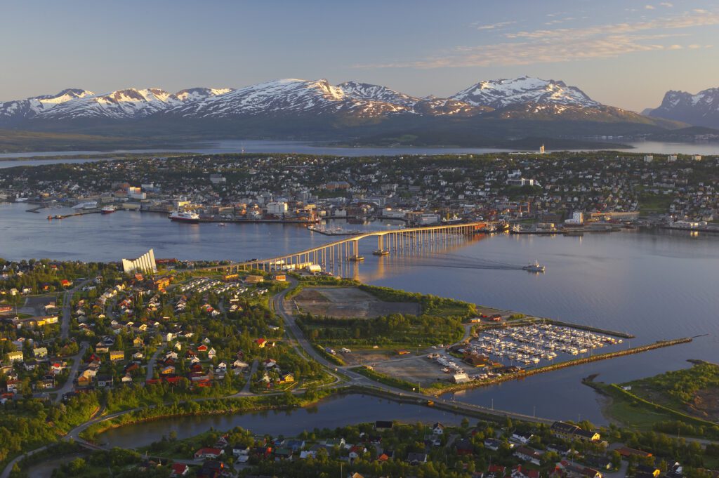tromsø in the summer with snowy mountains and midnight sun