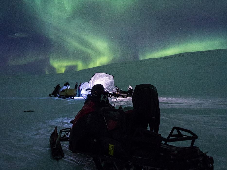 Northern Lights and the Magical Night Sky by Snowmobile