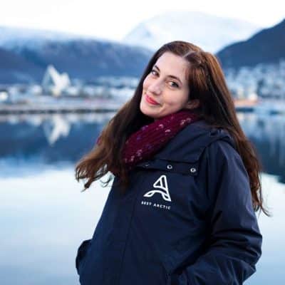 Portrait of a woman, Miriam, with Tromsø city blurred in the background
