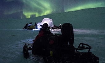 Northern Lights and the Magical Night Sky by snowmobile