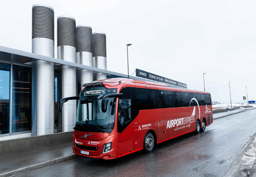 Red Airport Express bus stopped outside Tromsø Airport