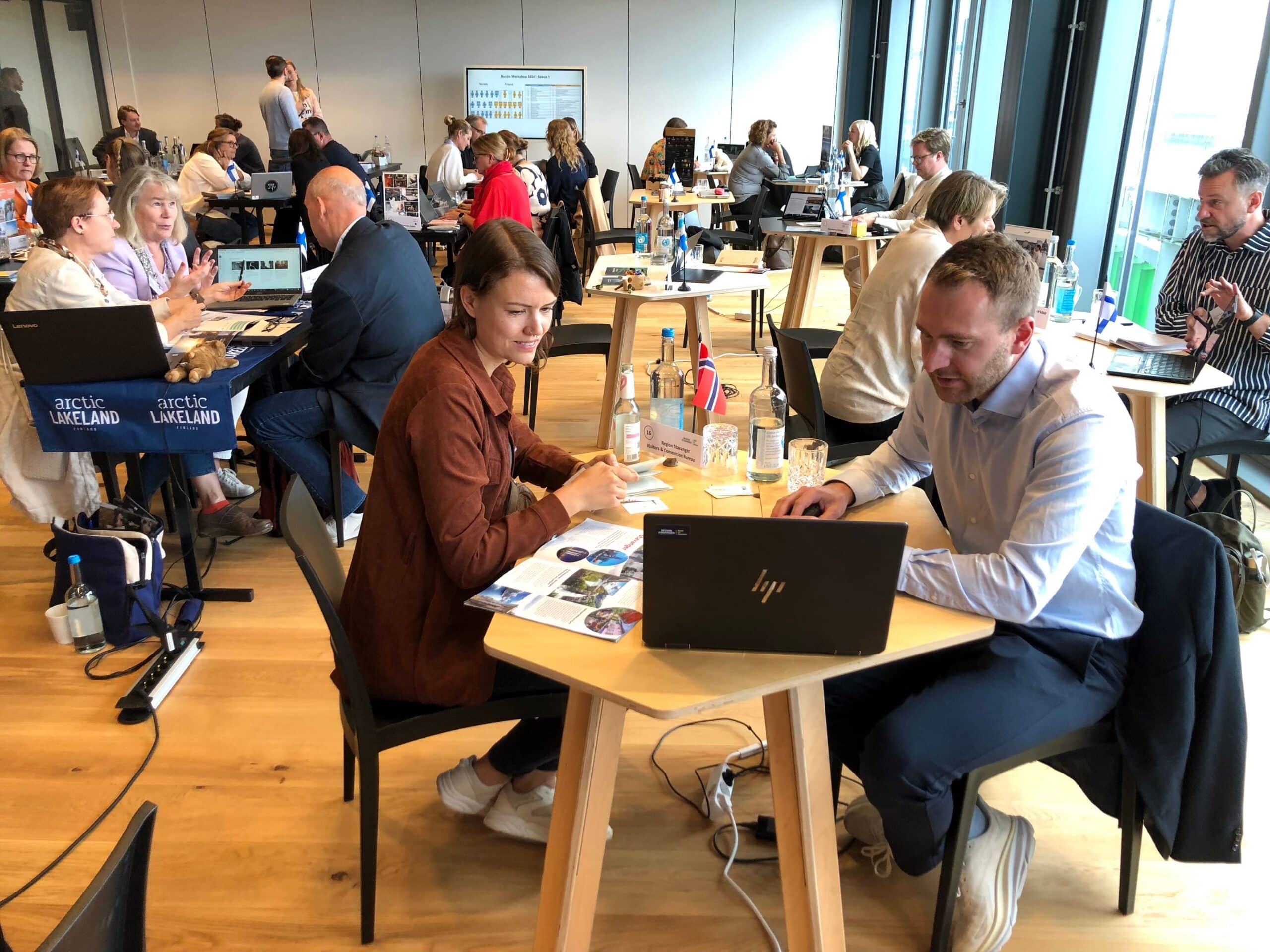 Business meeting between tour operators and destination representatives during a B2B tourism workshop