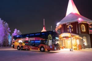 Aurora Express red double-decker bus parked at Santa Claus Village in Rovaniemi, Finland